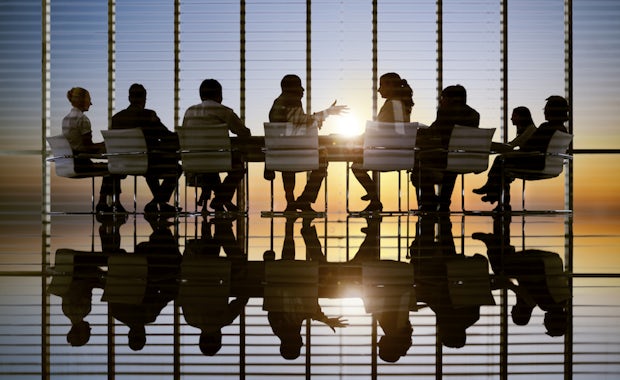Picture of business people in a meeting, to illustrate partner retirement assistance feature
