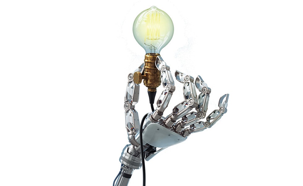 Picture of robot hand holding light bulb, to illustrate article on technology startups Germany law firms