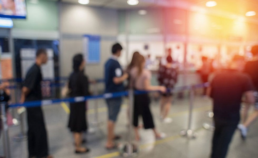 Blurred background queue to illustrate immigration procedure
