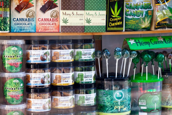 Amsterdam, Netherlands - August 27 2017: Variety of cannabis related products in a display case of a coffee shop in Amsterdam.
