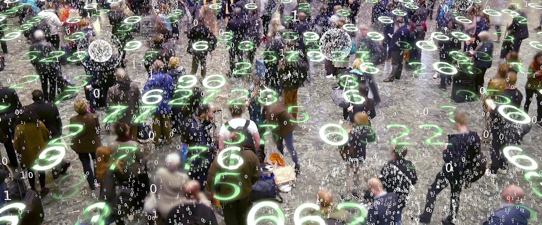Binary code bursts from phones held by people with a matrix style overlay of glowing electronic numbers.